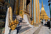 Bangkok Grand Palace, the Wat Phra Keow (temple of the Emerald Buddha), the stairs of the Royal Pantheon with five headed snake guardian.  